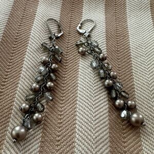 Dangling silver beaded earrings, approximately 3 inches in length.